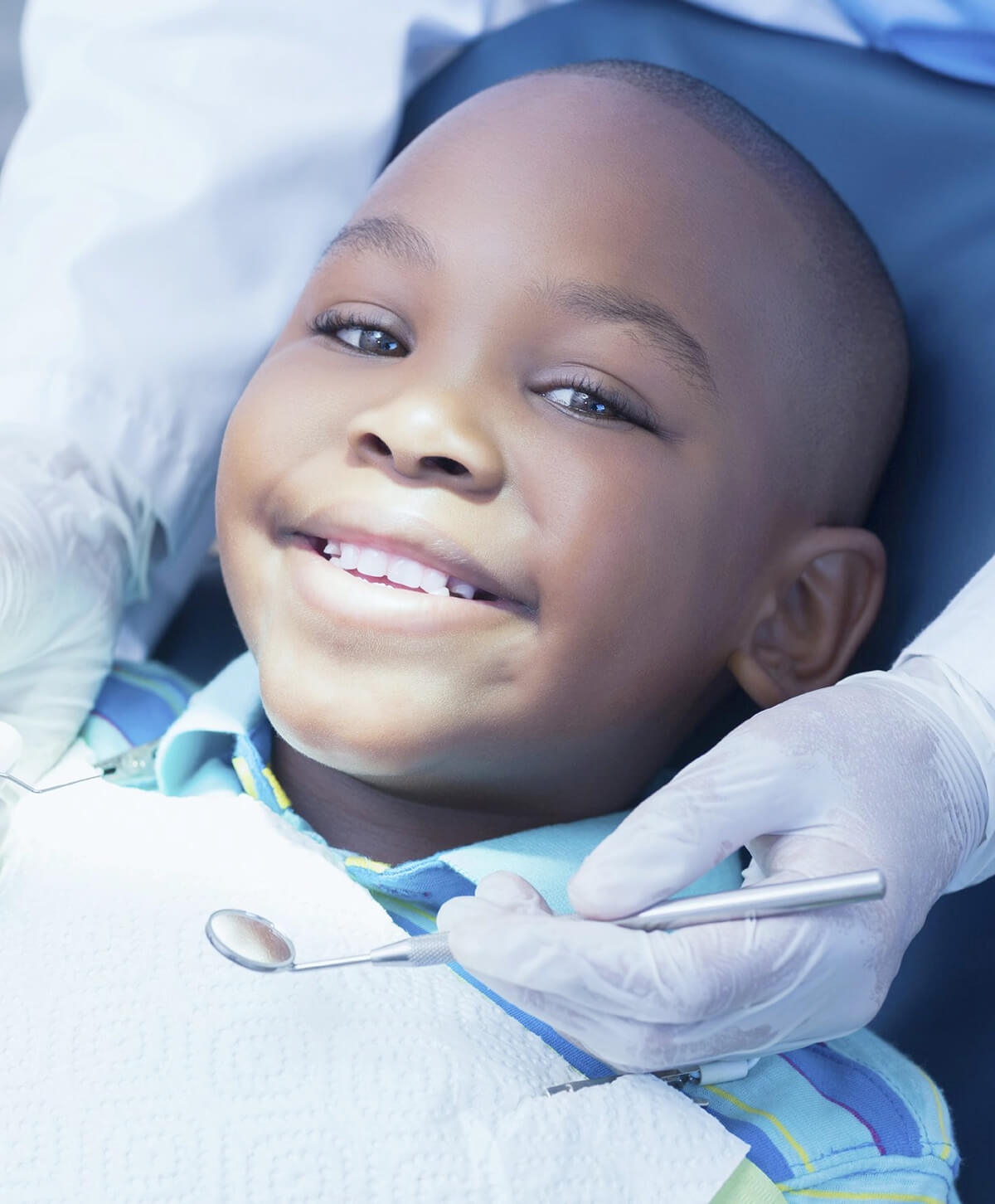 child smiling at dentist